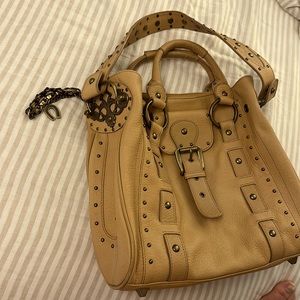 Authentic Betsy Johnson shakier bag with leopard interior.